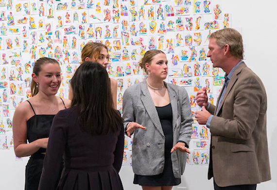 Image of President Kevin Weinman at a gallery opening at Steel Plant.